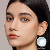 modelwearingcloud light blue colored contacts